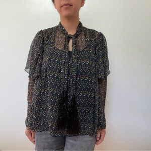 Sheer black blouse with fun multicolored pattern - tie collar with black detail.
